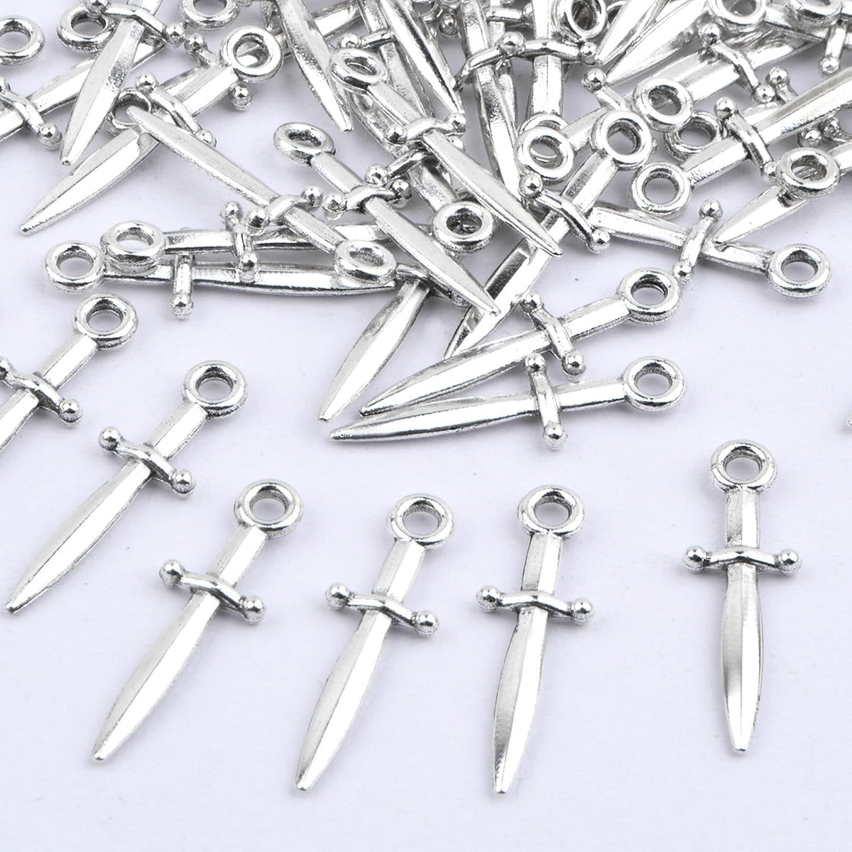 100 Pieces Antique Silver Swords Charms Vintage Alloy Weapon Sword Shaped Bookmark Dangle Pendants Craft Supplies for DIY Necklace Bracelet Jewelry Making Findings